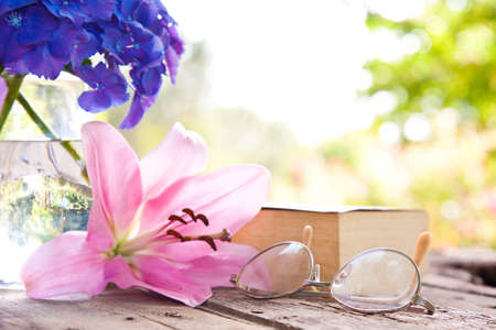 book on the old table with flowersの写真素材