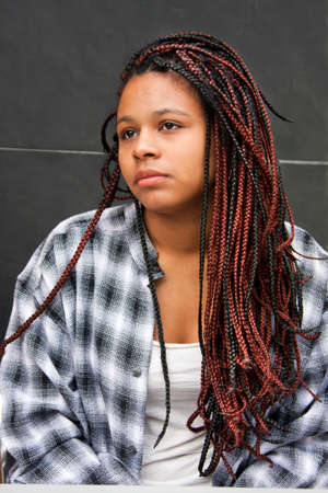 young brunette woman with braidsの写真素材
