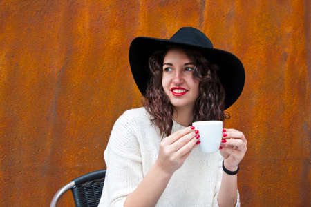 young woman drinking coffeeの写真素材