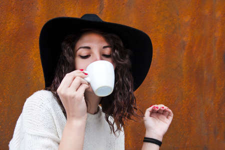 young woman drinking coffeeの写真素材