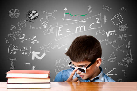 child looking at the books on the table school