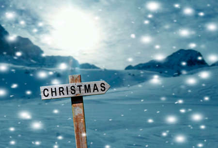 sign indicating christmas in the snowy mountains