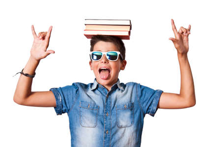 boy with books on headの写真素材
