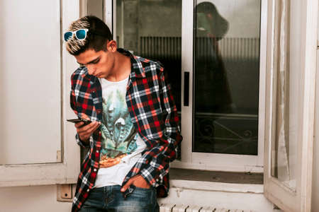 fashion man with mobile phoneの写真素材