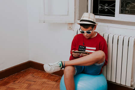 child with smartphone at homeの写真素材