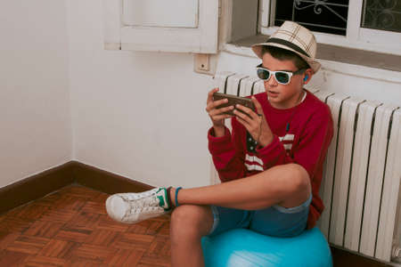 child with smartphone at home