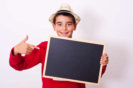 boy with blackboard isolated on whiteの写真素材