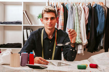 young man working in the shopの写真素材