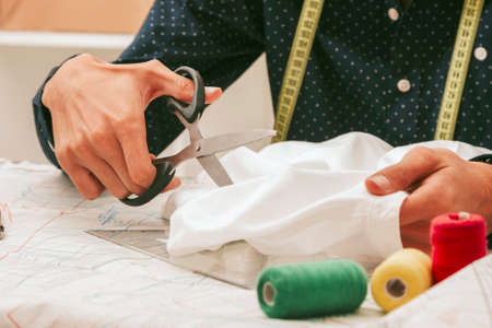 close-up of hands craftswomen tailor in a textile workshopの写真素材