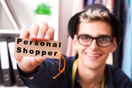 young man showing the label in the foregroundの写真素材