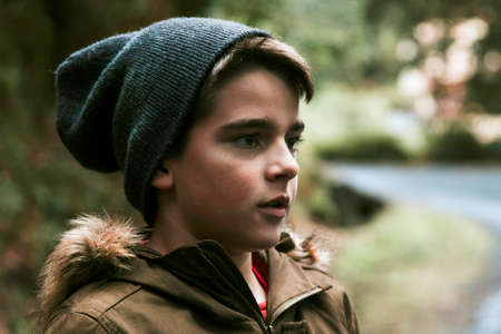 boy sheltered in the mountain forestの写真素材