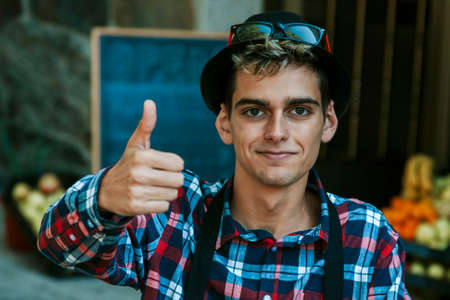 young businessman with a positive sign of approvalの写真素材