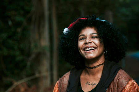 young girl with christmas hat outdoorsの写真素材