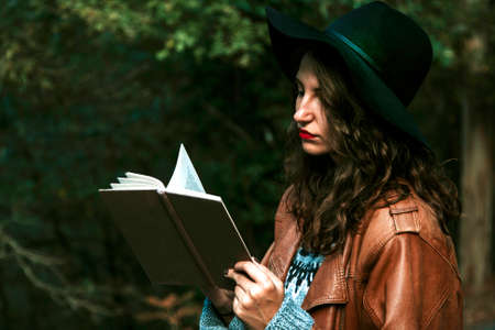 reading a book outdoorsの写真素材