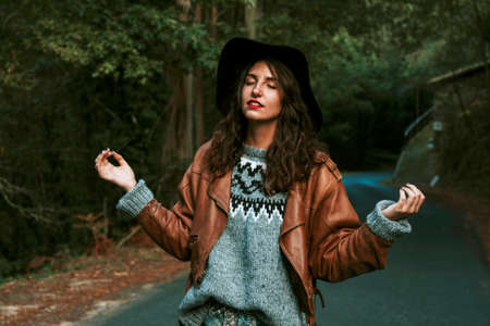 relaxed young woman enjoying natureの写真素材