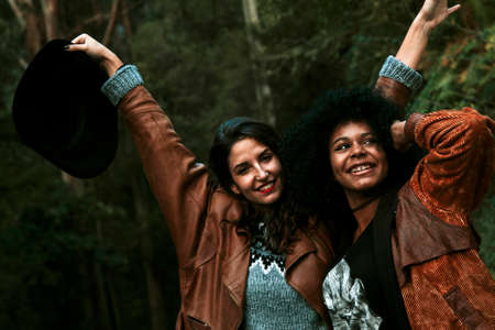 friends having fun and smiling outdoorsの写真素材