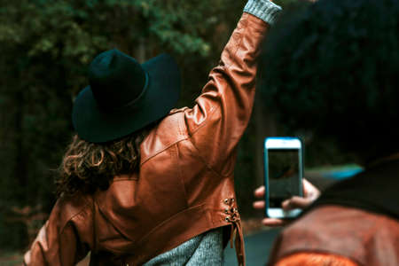 girls taking pictures with mobile phoneの写真素材