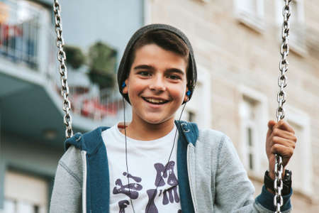 child on the city swingの写真素材