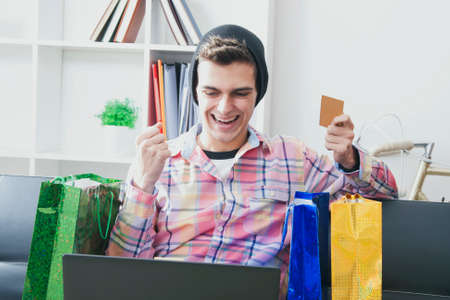 man in house buying online