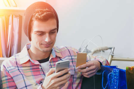 young shopping with mobile phone manの写真素材