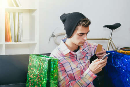 young shopping with mobile phone manの写真素材