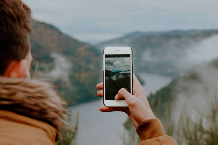 taking pictures with the phone to landscapeの写真素材