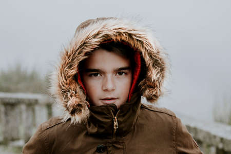 portrait of a boy sheltered in winterの写真素材