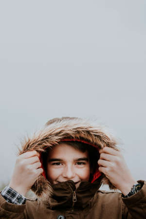 portrait of a boy sheltered in winterの写真素材