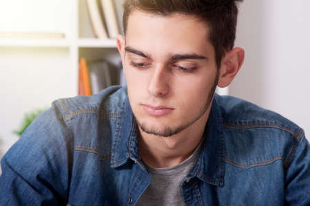 closeup and portrait of man young casual with the computer laptopの写真素材