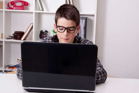 child in house with the computer laptop