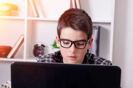 child in house with the computer laptopの写真素材