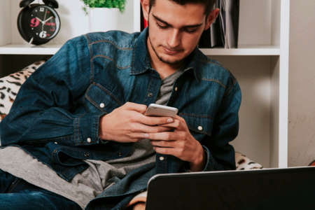young attractive of style casual with the telephone phone in the roomの写真素材