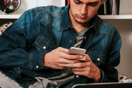 young attractive of style casual with the telephone phone in the roomの写真素材