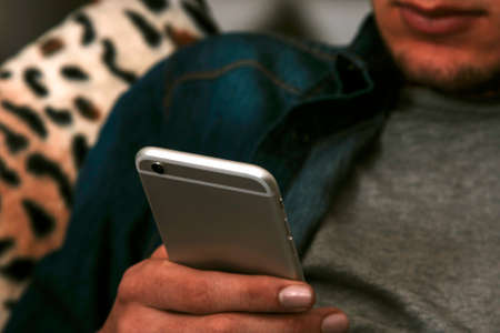 closeup of the hands with the mobile phone