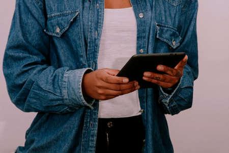 hands of young woman with the tabletの写真素材