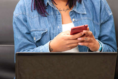 hands of female young with the phone mobile, closeupの写真素材