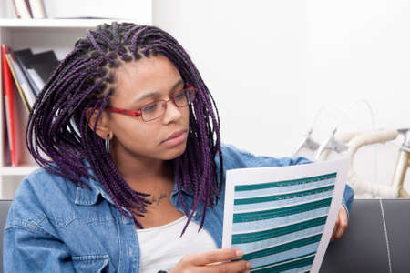 young woman at home buying by mobile phone