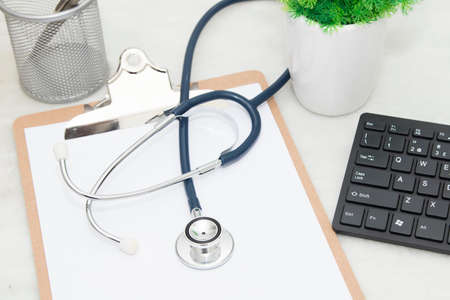 folder medical with the stethoscope and the computer on the desk, top viewの写真素材