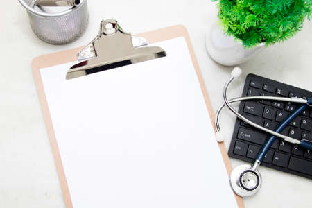 folder medical with the stethoscope and the computer on the desk, top viewの写真素材