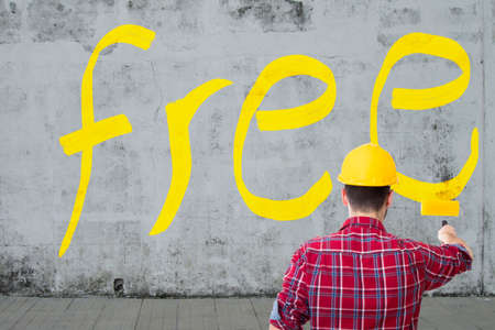 man painting on the wall the messageの写真素材