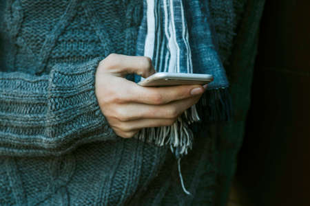 closeup hands with mobile phoneの写真素材