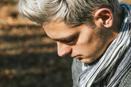 portrait of profile of male young to the fashion with the hair dyeing