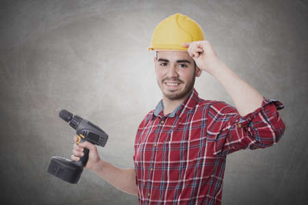 worker happy with the drill of DIY and construction