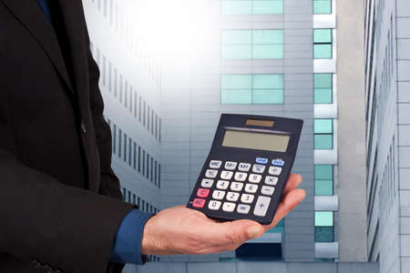 closeup of the calculator in hand, concept of finance and economicsの写真素材