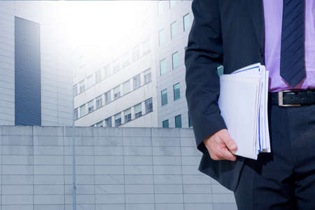 man of business with the papers in her handの写真素材