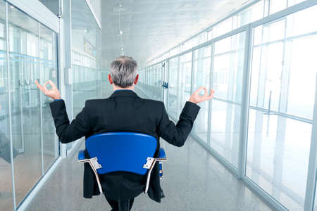 man of business in the chair in attitude relaxedの写真素材