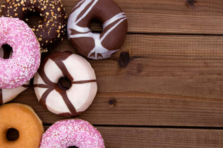 donuts and Bagels on antique woodの写真素材