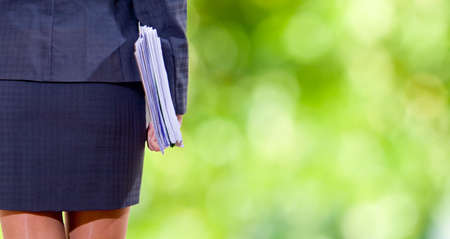 businesswoman with files or work in handの写真素材