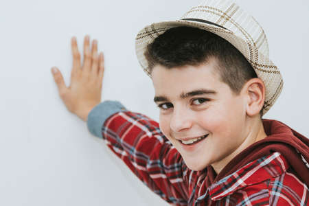 portrait of a boy with hat smilingの写真素材