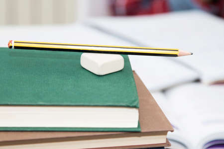 pencil and rubber on the books at schoolの写真素材